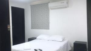 Ένα ή περισσότερα κρεβάτια σε δωμάτιο στο Hostal Jerry Inn