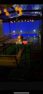 a swing with a sign that says diega at Villa Lamys Djerba Houmt Souk à 5 minute du centre ville in Al Hara Al Kabira +34 photos