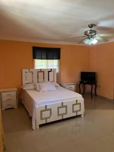 Postel nebo postele na pokoji v ubytování Cozy house in San Pedro