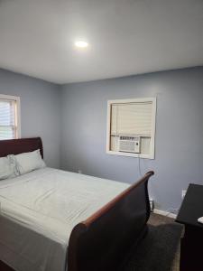 a bedroom with a bed and a window at 2BR in Peaceful Country Near Ithaca in Willseyville