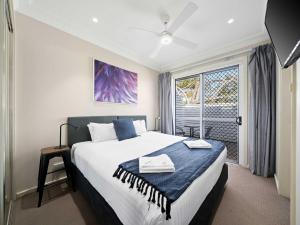 a bedroom with a large bed and a window at Prickly Pear Stays in Mayfield in Mayfield