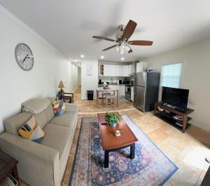 a living room with a couch and a table at Renovated 2 Bedroom in Durham! Superhost! in Durham