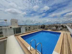 a swimming pool on the roof of a building at Samambaia East Side · Comfort in Samambaia in Brasilia