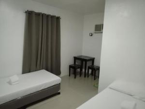 Letto o letti in una camera di Lei Kendee