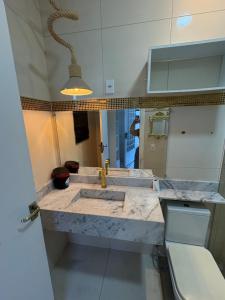 a kitchen with a sink and a counter top at Linda casa confortável em Manaus in Manaus