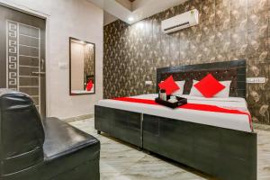 Ένα ή περισσότερα κρεβάτια σε δωμάτιο στο Hotel O Colour