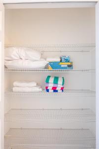 a bedroom with white shelves and a bed at Luxury & Comfy Family Gem near Disney with Pool andGym in Kissimmee