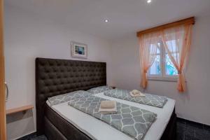 Postel nebo postele na pokoji v ubytování Crikvenica Apartment 17
