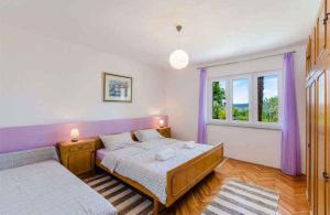 Posteľ alebo postele v izbe v ubytovaní Apartment in Crikvenica 5267