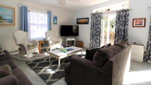 a living room with a couch and a table at 149 Emerald Avenue in West Cape May