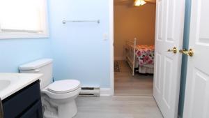 a bathroom with a white toilet and a sink at 149 Emerald Avenue in West Cape May +20 photos