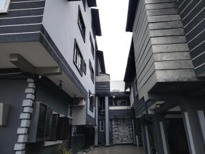 an alleyway between two buildings with stairs on the side at Caesar's Hotel & Apartment Room #4 in Ikeja