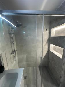 a shower with a glass door in a bathroom at TAJ house center altea #B in Altea +14 photos