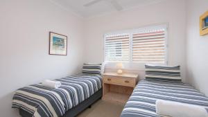 Cama ou camas em um quarto em Avalon 4