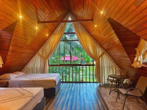 Ένα ή περισσότερα κρεβάτια σε δωμάτιο στο Green Paradise Bungalows