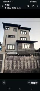 a black and white photo of a building at Caesar's Hotel & Apartment Room #10 in Ikeja