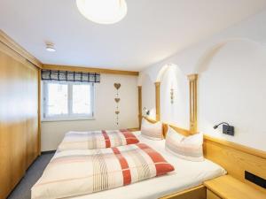 Giường trong phòng chung tại Holiday apartment with 2 bedrooms