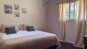 a bedroom with a large bed and a window at La Colorada Dolores in Dolores +16 photos