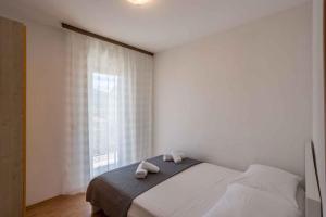 Postel nebo postele na pokoji v ubytování Apartment in Stari Grad - Insel Hvar 6321