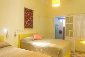 Postel nebo postele na pokoji v ubytování Casa de Don Pablo Hostel
