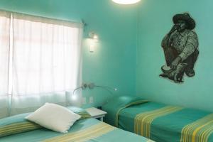 Postel nebo postele na pokoji v ubytování Casa de Don Pablo Hostel