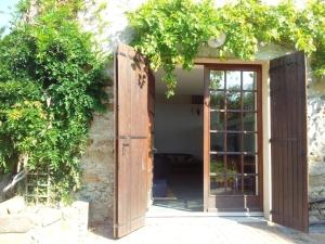 an open door leading into a building with a window at Charmante grange rénovée avec vue proche de Moulins - FR-1-489-576 in Bressolles
