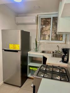 Cucina o angolo cottura di Lizard King Hotel & Suites
