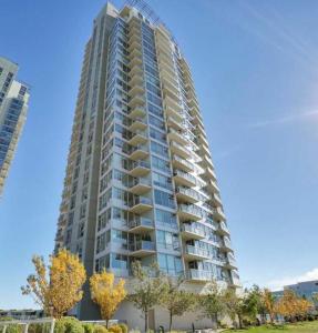 a large apartment building with balconies on the side of it at 17th Avenue Paranomas Escape in Calgary
