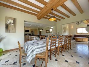 a dining room with a table and some chairs at Maison de campagne avec spa, jardin clos, jeux pour enfants et chemin de randonnée à proximité - FR-1-497-211 in Les Ventes-de-Bourse