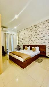 Postel nebo postele na pokoji v ubytování Royal Retreat ,Kandy