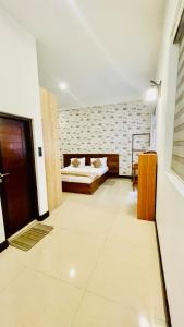Postel nebo postele na pokoji v ubytování Royal Retreat ,Kandy