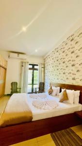 Postel nebo postele na pokoji v ubytování Royal Retreat ,Kandy