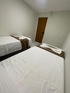 Postel nebo postele na pokoji v ubytování Rede de Hotel 99