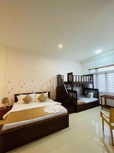 Postel nebo postele na pokoji v ubytování Royal Retreat ,Kandy