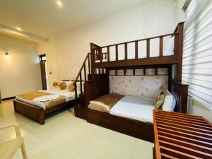 Postel nebo postele na pokoji v ubytování Royal Retreat ,Kandy