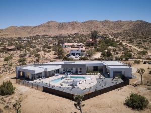 an aerial view of a house in the desert at Orchid by Fieldtrip Architectural Estate w Pool, Spa, Game Room in Yucca Valley
