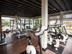 a gym with several treadmills and cardio machines at Dusit Grand Condo View Jomtien By Snap Hosting in Jomtien Beach