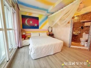 Postel nebo postele na pokoji v ubytování Hi Young Castle