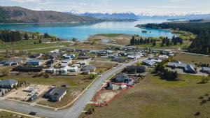 an aerial view of a village next to a lake at Simply Stunning Stars A in Lake Tekapo