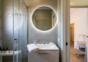 a bathroom with a sink and a mirror at Charming Malaga Retreat, Main House plus Cozy Casita in Málaga +33 photos