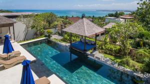 an aerial view of a swimming pool at a villa at Villa Adenium by Elite Havens in Jimbaran