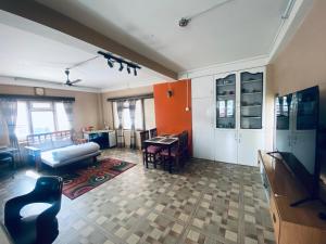 a living room with a couch and a table at Lilen's Homestay-Entire Apartment with Private Bathroom and Kitchen in Kathmandu
