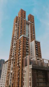 a tall building with many windows on top of it at Hansar Bangkok Hotel in Bangkok