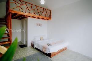 Katil atau katil-katil dalam bilik di Flamboyan Cabin By Travelink