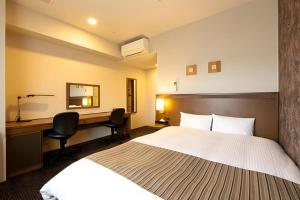 Postel nebo postele na pokoji v ubytování Toyooka Green Hotel Morris + 26 fotografií