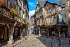 a street in an old town with wooden buildings at Les Pâquerettes in Dinan
