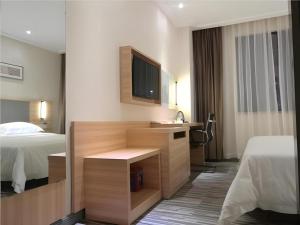 Ένα ή περισσότερα κρεβάτια σε δωμάτιο στο City Comfort Inn Shenzhen Shiyan Science and Technology Park +55 φωτογραφίες