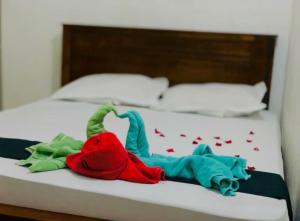Ένα ή περισσότερα κρεβάτια σε δωμάτιο στο Green Hotel Kandy