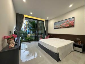 Postel nebo postele na pokoji v ubytování Happy Home Villa Flamingo Hải Tiến
