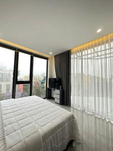 Postel nebo postele na pokoji v ubytování Happy Home Villa Flamingo Hải Tiến + 12 fotografií